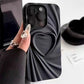 Black silicone phone case with a 3D heart and wrinkle design.