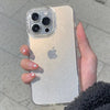 A hand holds a clear glitter phone case on a light-colored iPhone.